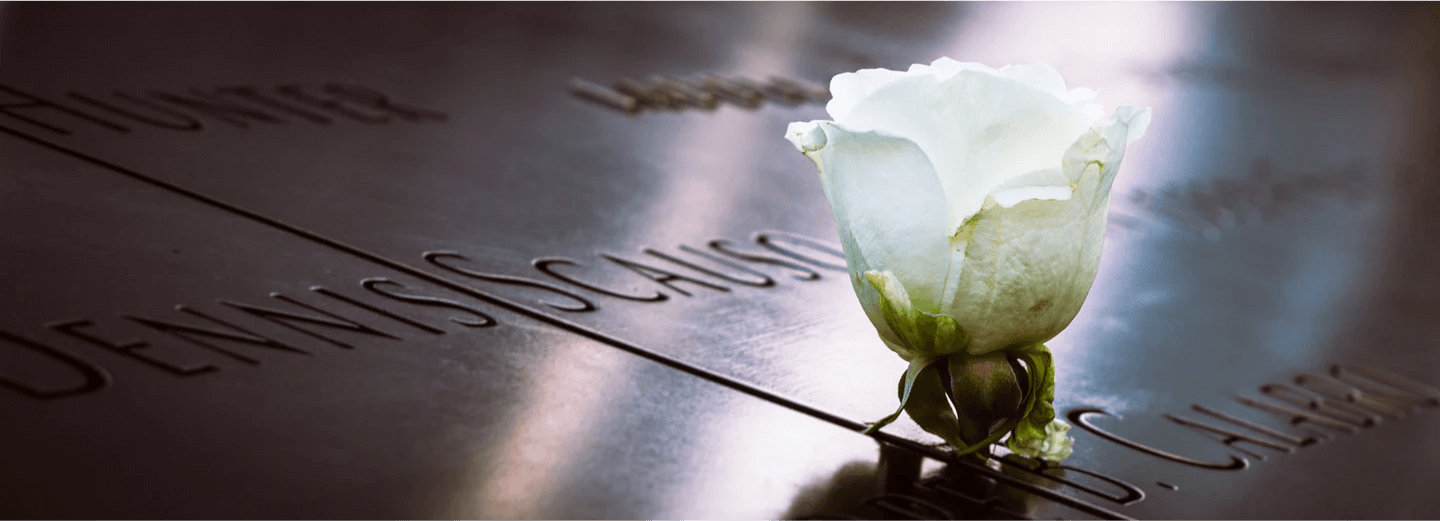 A flower on a memorial plaque. 