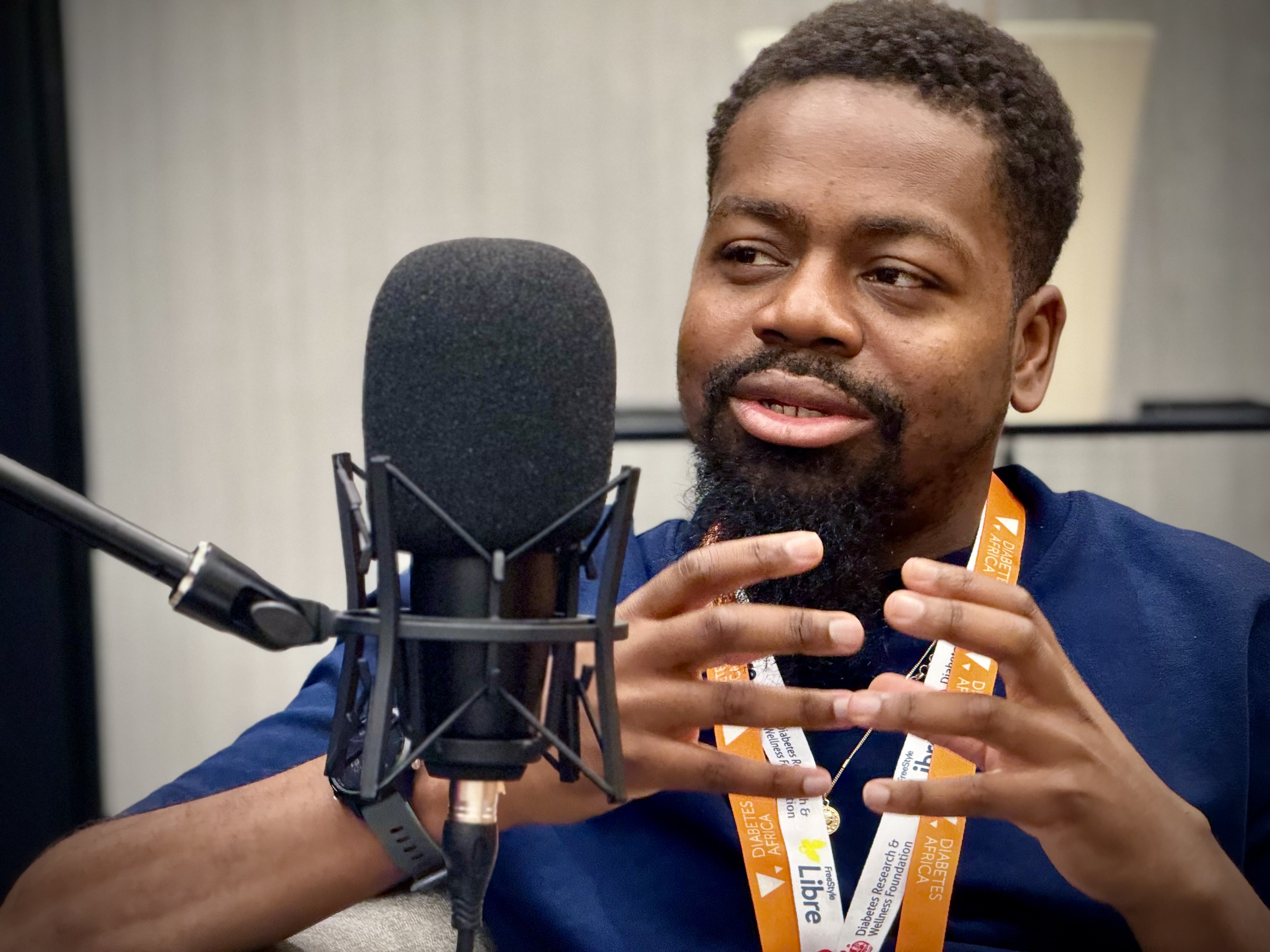 Daniel Newman at UTD 2024 talking into a microphone.