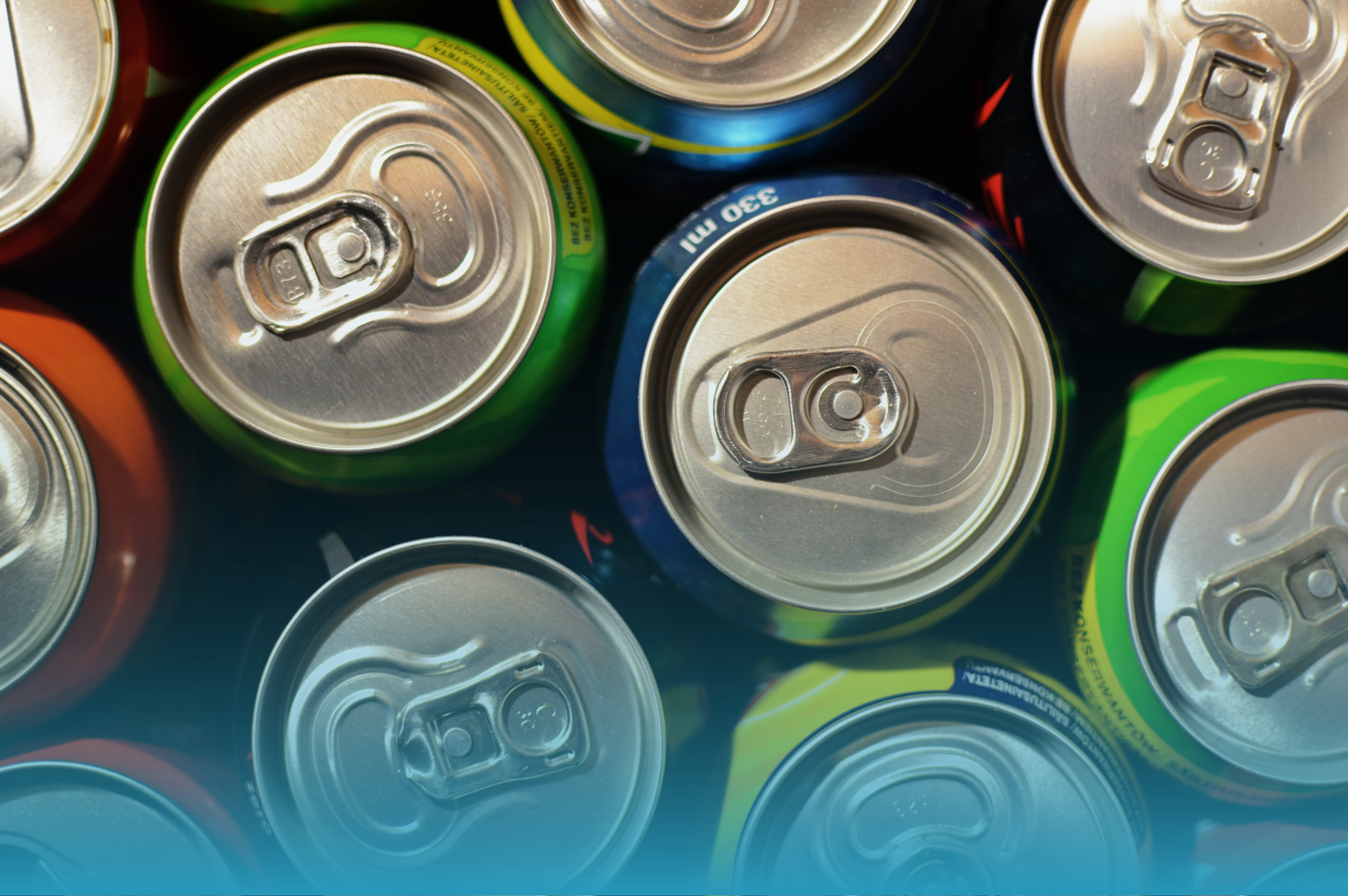 The tops of assorted fizzy drink cans. 