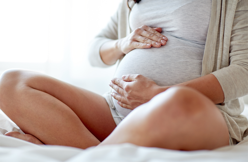 Pregnant Woman Sitting Down R